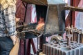 Male blacksmith working in workshop, London. Concept