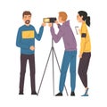 Male Blogger Streaming Online, Cameraman and Assistant Recording Video with Camera on Tripod, Social Media Blogging Royalty Free Stock Photo