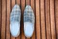 Male blue shoes over the wooden table Royalty Free Stock Photo