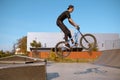 Male bmx biker, jump in action, skatepark Royalty Free Stock Photo