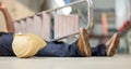 Male body lying on the floor after a work accident.