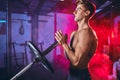 Male bodybuilder champion exercises with heavy weight barbell plate in gym. Royalty Free Stock Photo