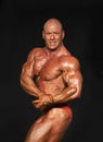 Male Bodybuilder Displays Side-Chest Pose