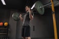 Athlete exercising with barbell at gym Royalty Free Stock Photo