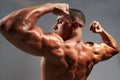 Male bodybuilder flexing his biceps Royalty Free Stock Photo