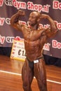 Male bodybuilder shows his best front double biceps pose Royalty Free Stock Photo