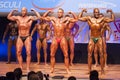 Male bodybuilders flex their muscles and show their best physiqu