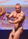 Male bodybuilders flex their muscles and show their best physiqu