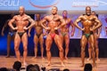 Male bodybuilders flex their muscles and show their physique