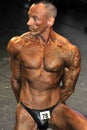 Male bodybuilding contestant showing his best