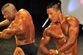 Male bodybuilding contestant showing his chest pose