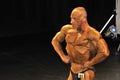 Male bodybuilding contestant showing his chest pose