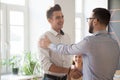 Male boss handshaking intern greeting with job promotion Royalty Free Stock Photo