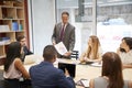 Male boss holding document at a business boardroom meeting Royalty Free Stock Photo