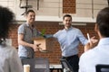 Male boss introduce excited new worker to office team