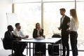 Male boss introduce female newcomer at meeting Royalty Free Stock Photo