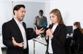 Male boss pointinting to misses in work to woman manager Royalty Free Stock Photo