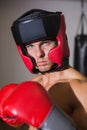 Male boxer in defensive stance in health club