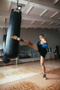 Male boxer hitting punching bag at gym Royalty Free Stock Photo