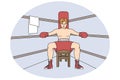 Male boxer sit in ring preparing for match