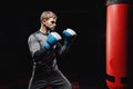 Male boxing in punching bag Royalty Free Stock Photo