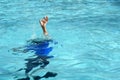 Male boy struggling underwater drowning in swimming pool