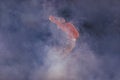 Male break-dancer jumps off high in the air while performing a cool dance move, a lot of smoke in the background Royalty Free Stock Photo