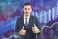 Broker showing double thumbs up as rise in stock market graph Royalty Free Stock Photo