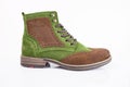 Male brown and green leather boot on white background. Royalty Free Stock Photo