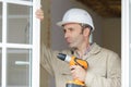 male builde holding drill Royalty Free Stock Photo