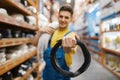 Male builder with coil of wires in hardware store Royalty Free Stock Photo