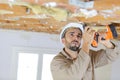 Male builder with drill indoors Royalty Free Stock Photo