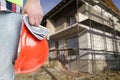 Male builder or engineer holding hardhat and gloves Royalty Free Stock Photo