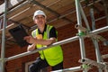 Construction Foreman Builder Architect on Building Site With Clipboard Royalty Free Stock Photo