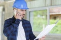 male builder foreman talking on cell phone Royalty Free Stock Photo