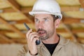 male builder in hardhat with walkie talkie Royalty Free Stock Photo