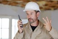 male builder in hardhat with walkie talkie Royalty Free Stock Photo