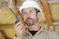 male builder in hardhat with walkie talkie Royalty Free Stock Photo