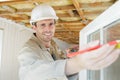Male builder measuring window Royalty Free Stock Photo