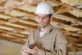 Male builder preparing to use cordless drill