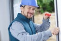 male builder screwing pvc windows Royalty Free Stock Photo