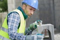Male builder working with cement block Royalty Free Stock Photo