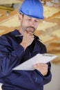 male builder in yellow hard hat with clipboard Royalty Free Stock Photo