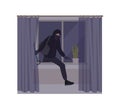 Male burglar wearing mask and hoodie breaking in house or apartment. Theft, burglary or housebreaking. Thief, burglar
