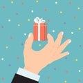Male business hand hold present box gift, christmas souvenir isolated on blue flat vector illustration. Concept holiday