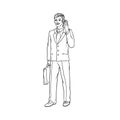 Male businessman in a business suit and a suitcase to talk on the cell phone in hand. Worker in finance and trade