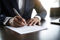 Male Businessman, Dressed In Suit, Signing Document With His Pen, Carefully Adding His Signature To