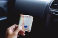 A male businessman pays taxi fare in euros with a tip for excellent service. Business concept