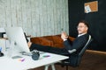 Male businessman smile on his workplace in office armchair Royalty Free Stock Photo