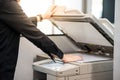 Male businessman using photocopier in office Royalty Free Stock Photo